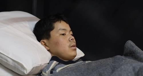 This image captured from Ukrainian President Volodymyr Zelenskyy's social media on Tuesday, shows a man reported to be a North Korean soldier captured by Ukrainian forces. (Zelenskyy's X page)