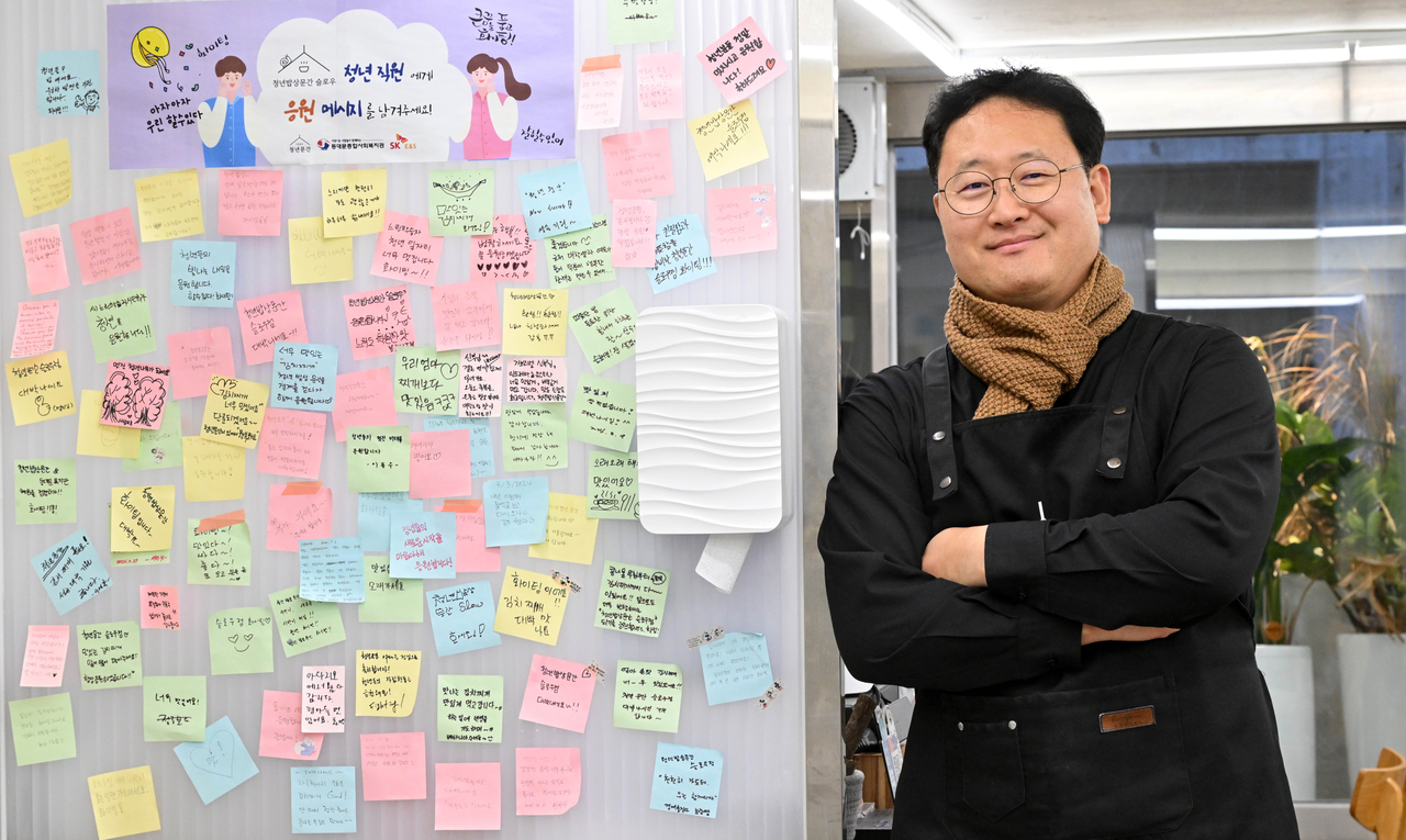 Catholic priest Gabriel Lee Mun-su poses for a photo at his kimchi jjigae restaurant, Youth Mungan in Seoul, ahead of his interview with The Korea Herald on Dec. 16. (Im Se-jun/The Korea Herald)