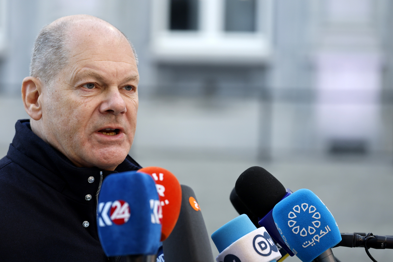 Germany's Chancellor Olaf Scholz speaks with the media as he arrives for an EU summit at the Egmont Palace in Brussels, Monday. (AP-Yonhap)