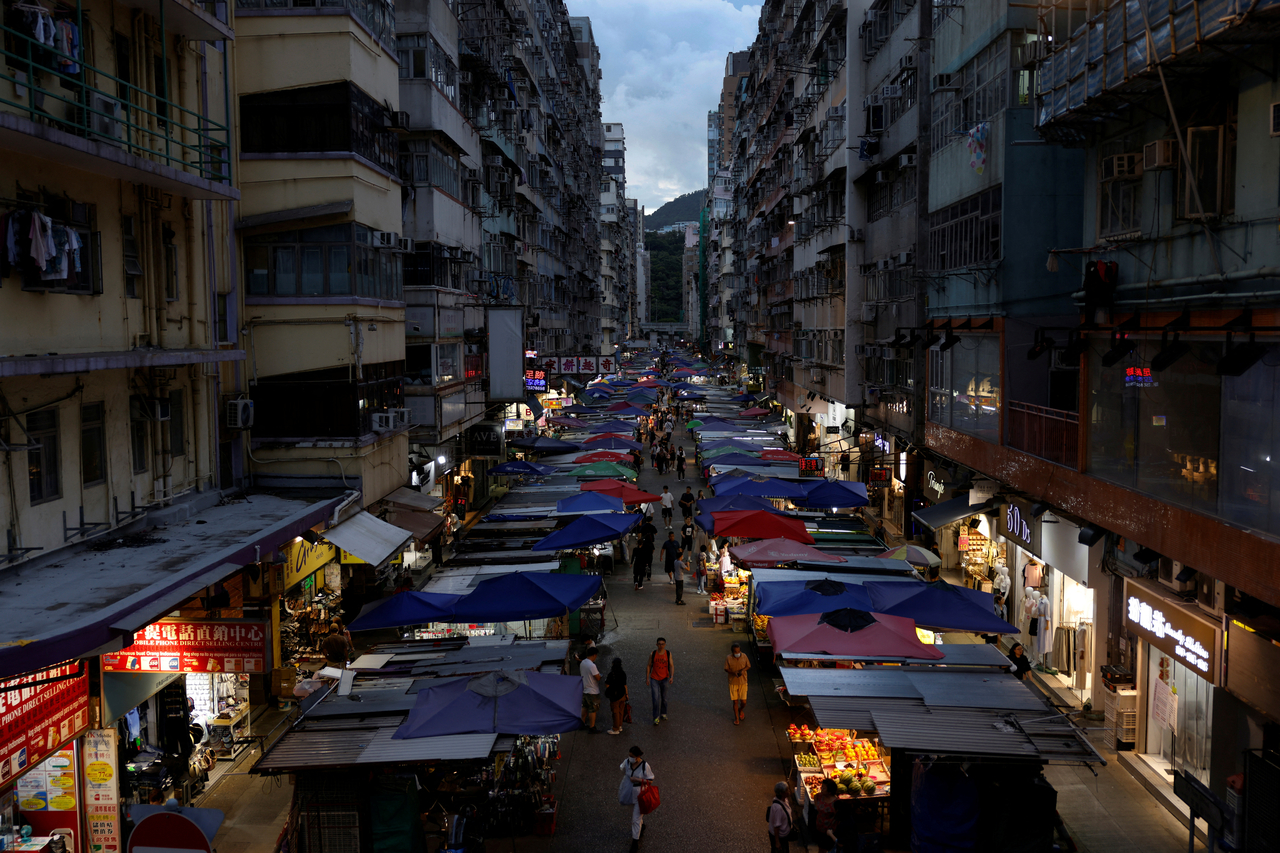 A view of residential buildings in Mong Kok, where many “coffin” homes are located due to convenient transportation, in Hong Kong, China, July 22, 2024. Sub-divided flats and “coffin” homes are usually located in outdated residential buildings in old business areas, allowing access to workplaces and schools at a price residents can afford.  [REUTERS]