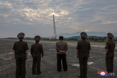 North Korean leader Kim Jong-un (center) and officials observe the test launch of the regime's tactical ballistic missile, Hwasongpho-11-Da-4.5, on Sept. 18, 2024. (Yonhap)