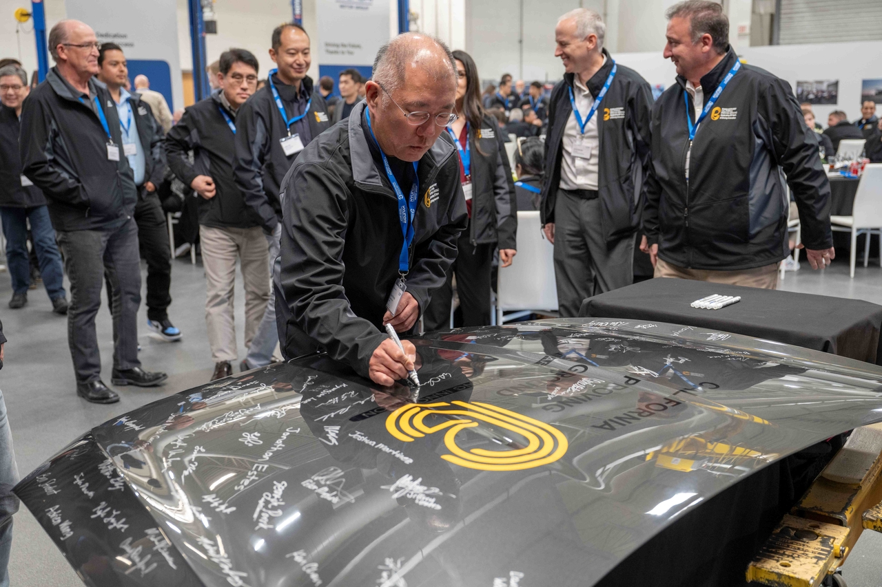 Hyundai Motor Group Executive Chair Chung Euisun signs a vehicle hood to commemorate the automaker's California Proving Ground’s 20th anniversary in California City on Monday. (Hyundai Motor Group)