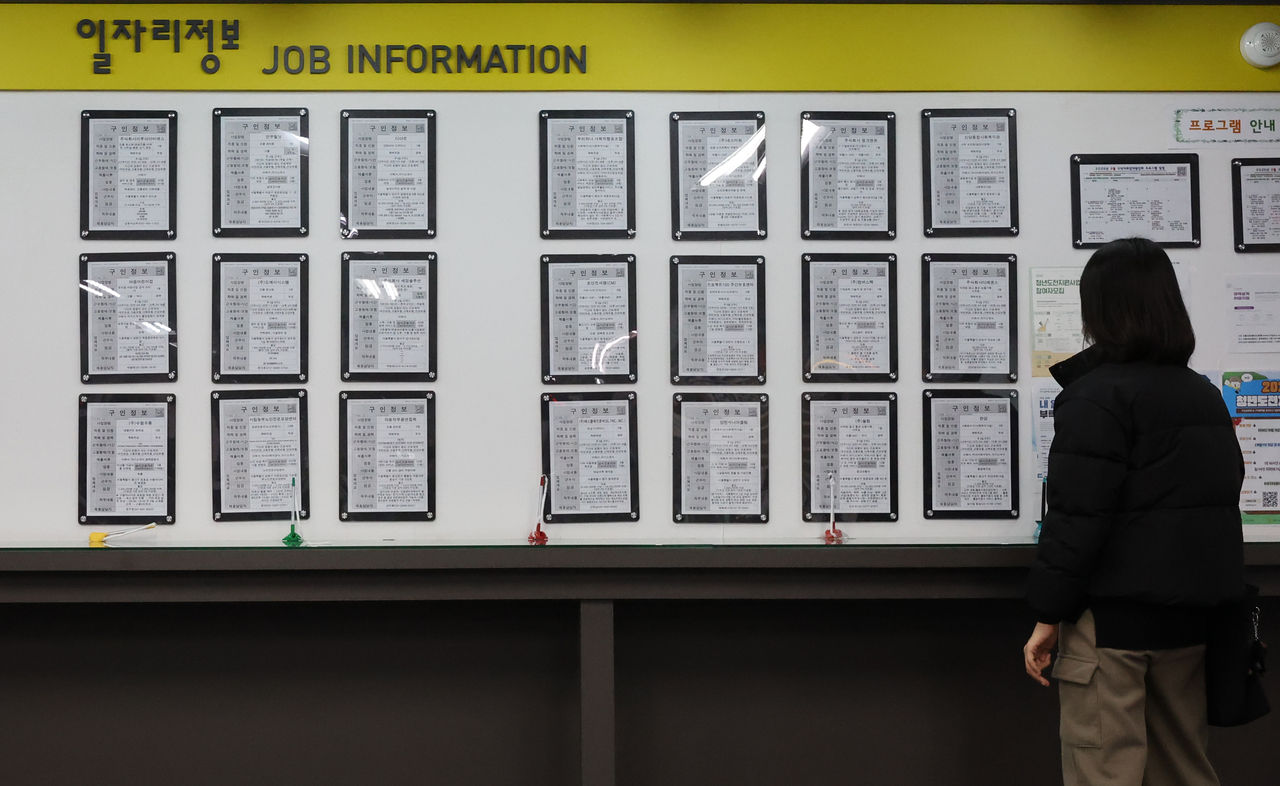 A jobseeker checks job posts at an employment center in Seoul on Saturday. (Yonhap)