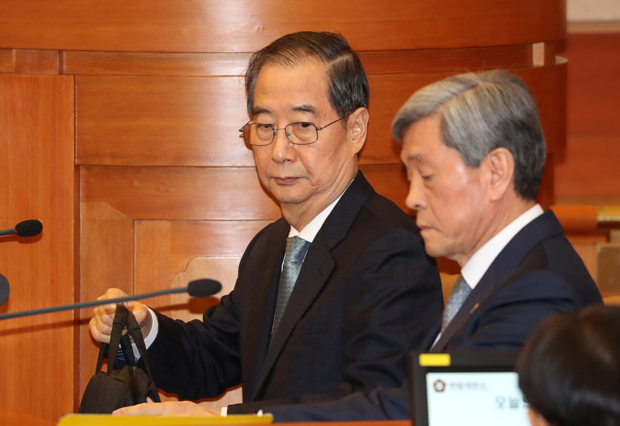 Prime Minister Han Duck-soo attends his impeachment trial on Wednesday. (Yonhap)