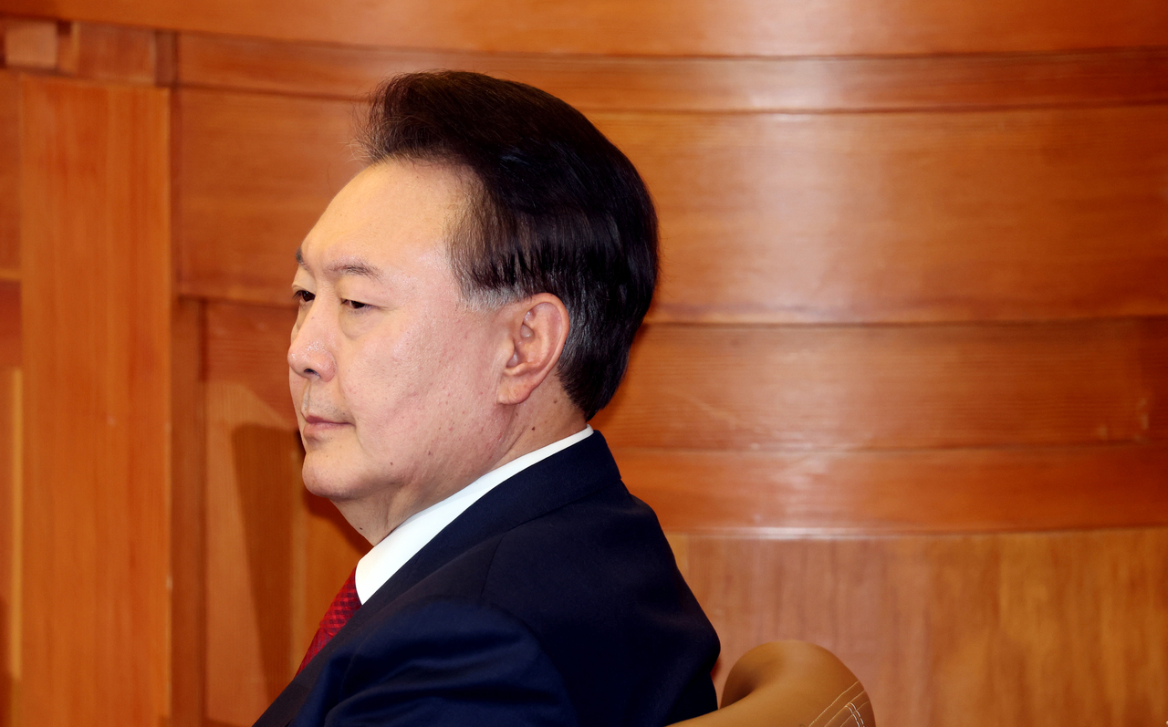 President Yoon Suk Yeol attends the 10th hearing of his impeachment trial at the Constitutional Court in Seoul on Friday. (Pool photo via Yonhap)