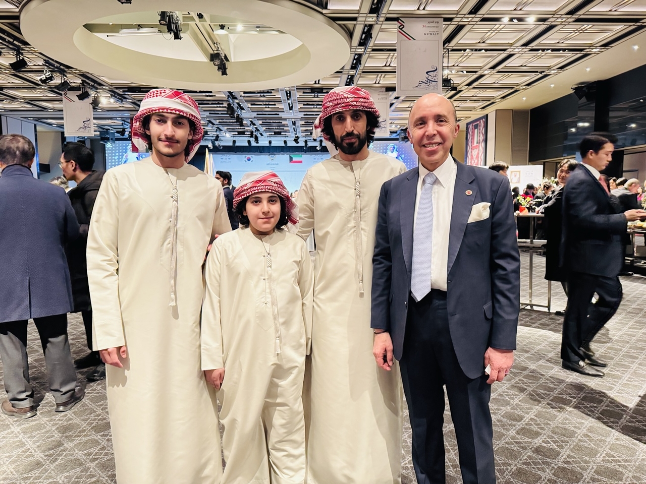 Participants pose for a photo with Chafik Rachadi (right), who is the Moroccan ambassador to Korea and the dean of the Korea diplomatic corps, at an event for Kuwait’s 64th National Day at the Grand Hyatt Seoul on Thursday. (Sanjay Kumar/The Korea Herald)