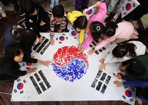 Putting hands together to remember March 1