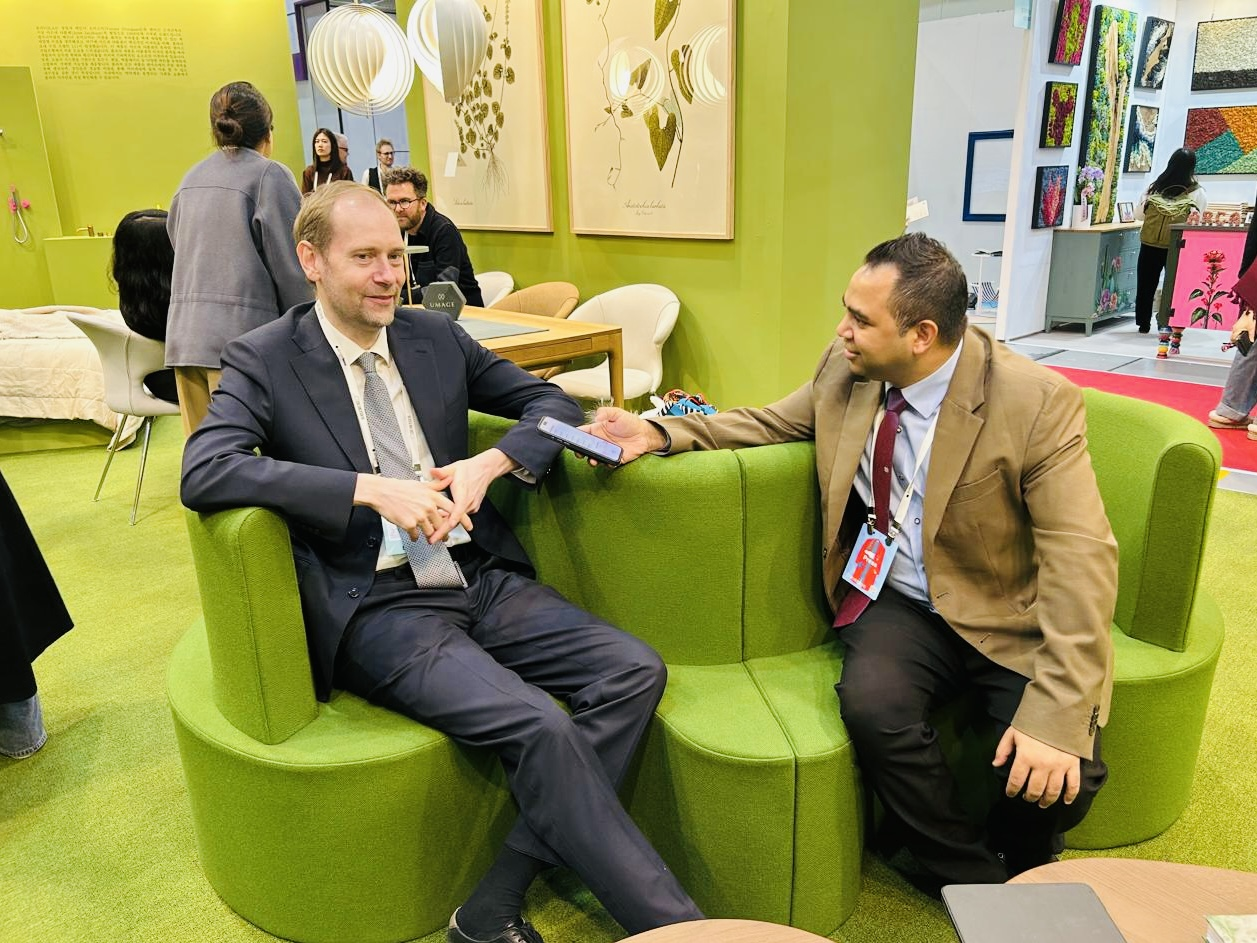 Joachim Arup Fishcher (left), commercial counsellor, interacts with a Korea Herald  reporter at the Denmark Pavilion at the 2025 Seoul Living Design Fair in the Coex Convention Center in Seoul. (Sanjay Kumar/ The Korea Herald)