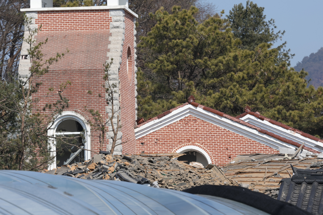 A damaged church building and debris are seen in Pocheon, Gyeonggi Province, after a South Korean Air Force KF-16 accidentally dropped multiple MK-82 bombs during a military exercise on Thursday.  (Yonhap)