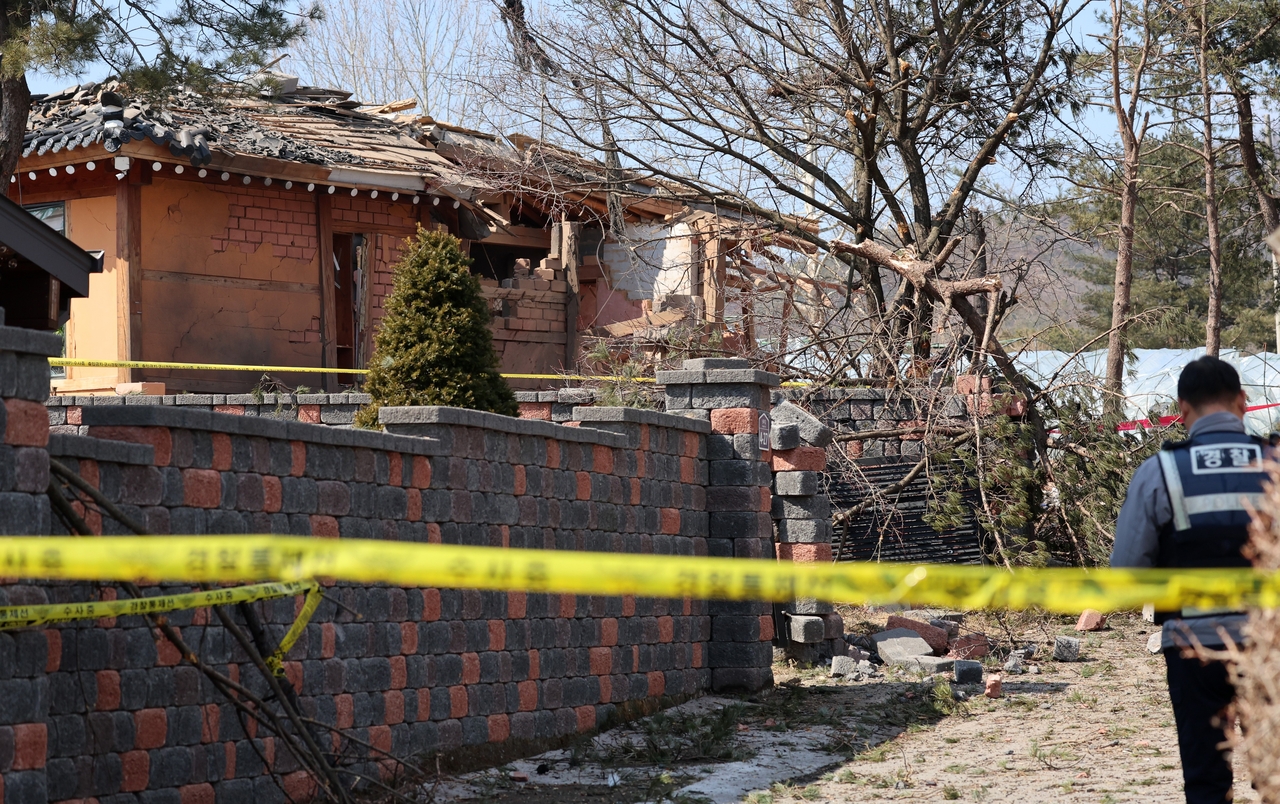 A damaged house and debris are seen in Pocheon, Gyeonggi Province, after a South Korean Air Force KF-16 accidentally dropped multiple MK-82 bombs during a military exercise on Thursday. Seven people were injured in the explosions. (Joint Press Corps)