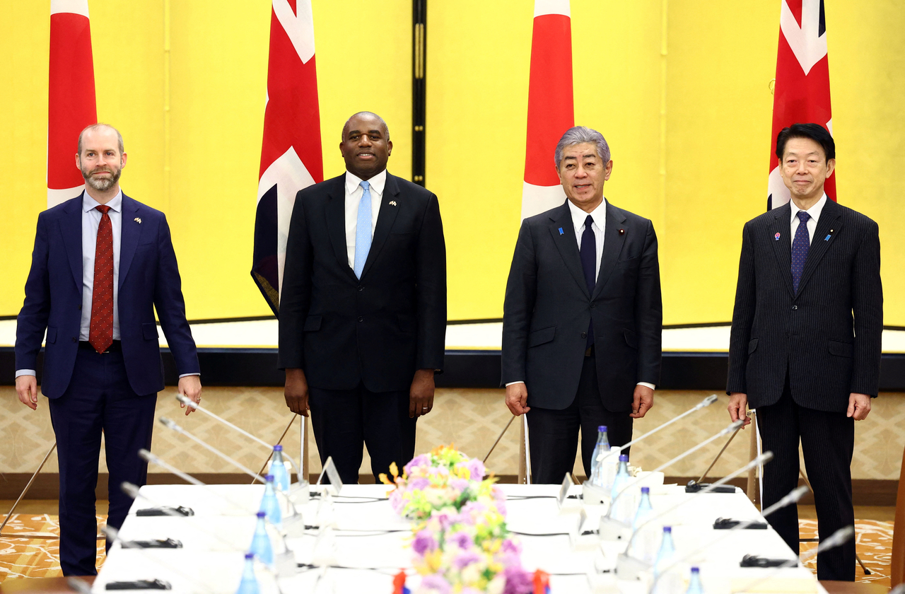 Britain's Foreign Secretary David Lammy (from left) and Secretary of State for Business and Trade Jonathan Reynolds, and Japan's Foreign Minister Takeshi Iwaya and Economy, Trade and Industry Minister Yoji Muto attend a 2+2 economic meeting in Tokyo, Japan, Friday. (Reuters-Yonhap)
