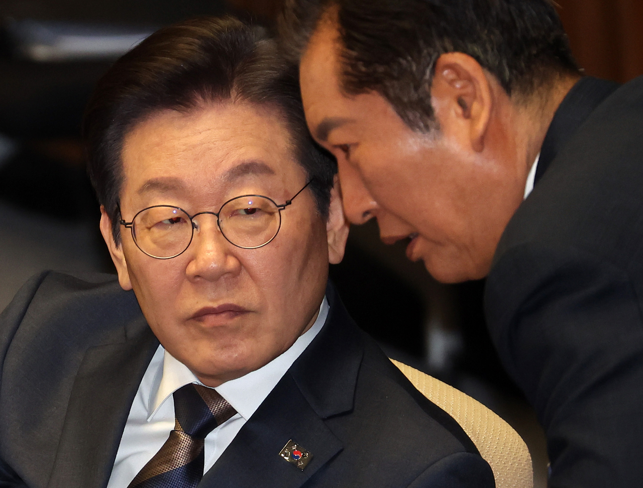 Democratic Party of Korea leader Rep. Lee Jae-myung (left) at the National Assembly plenary session on Saturday. Yonhap