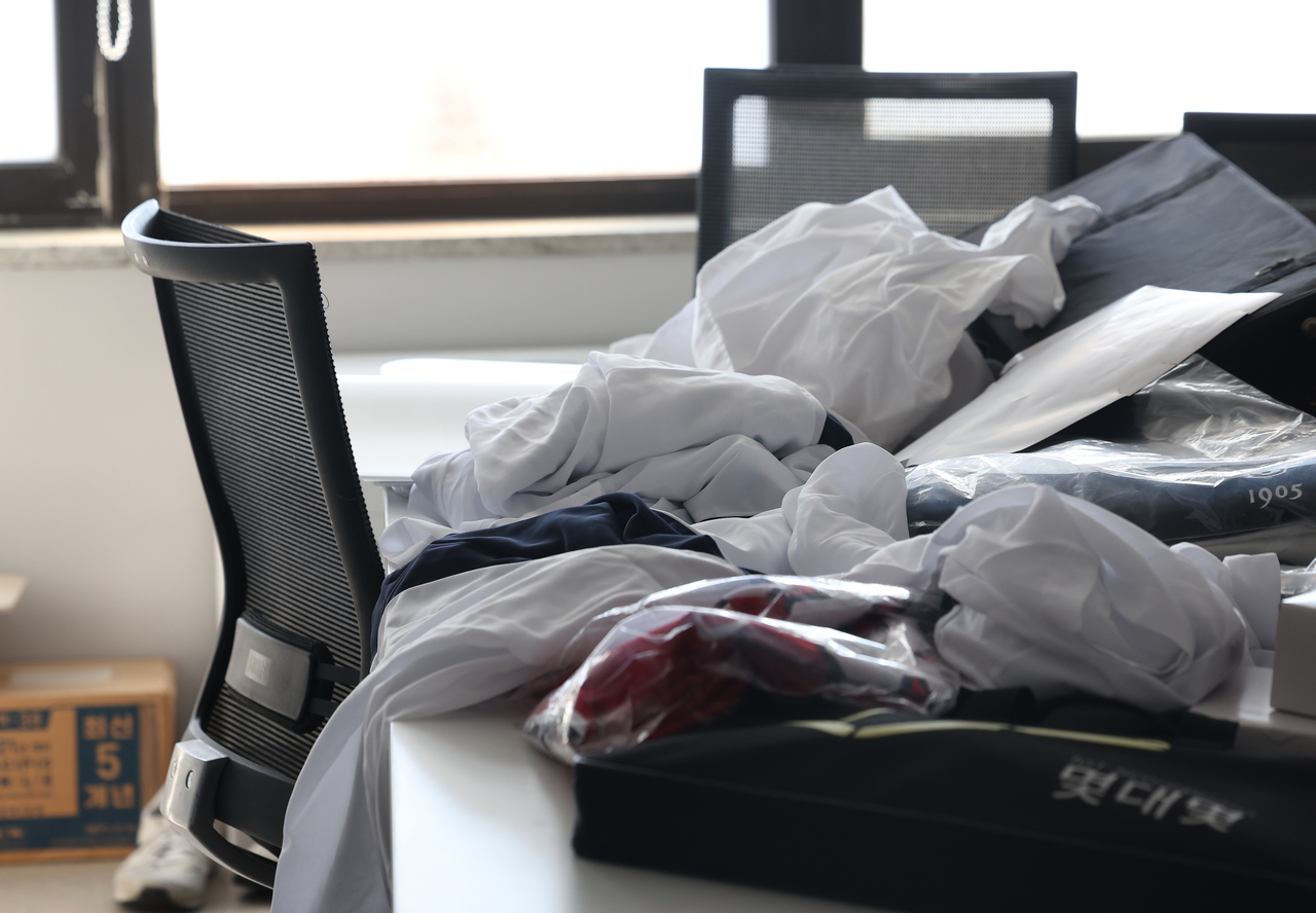 This photo shows medical gowns piled up at a classroom at a medical school in Seoul. (Yonhap)