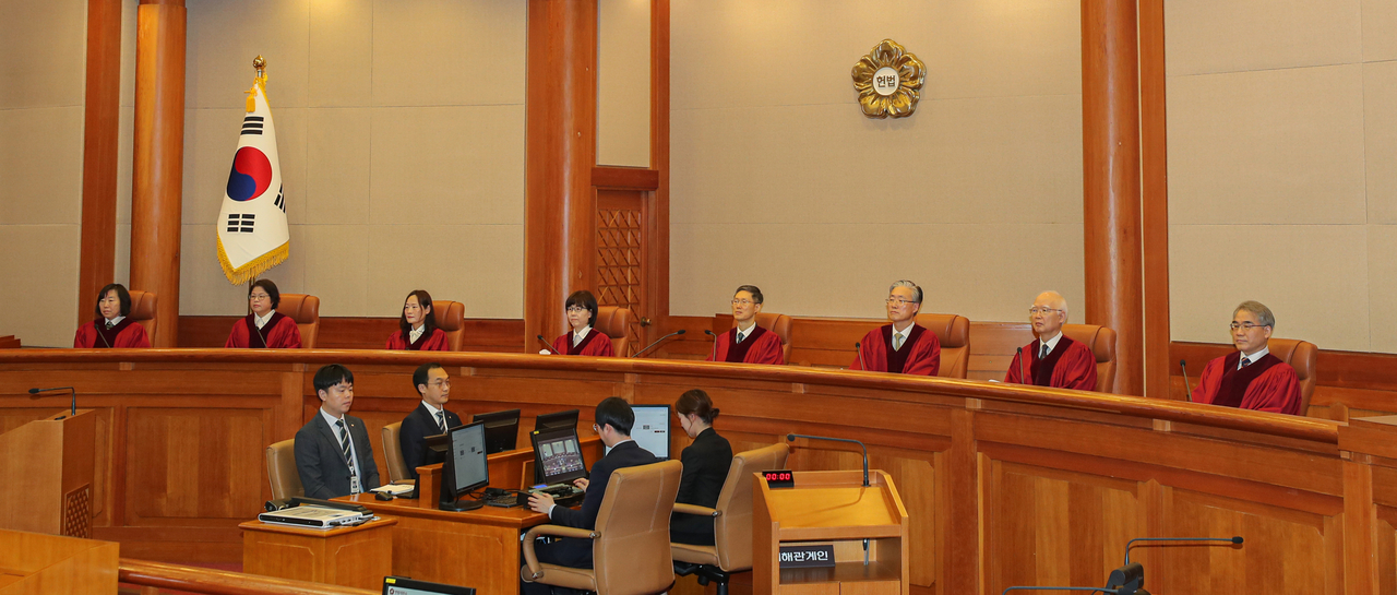 The Constitutional Court of Korea justices are seen during the verdict on Prime Minister Han Duck-soo's impeachment trial in Seoul on Monday. (Yonhap)