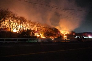 Fire response level raised to highest as wildfires spread