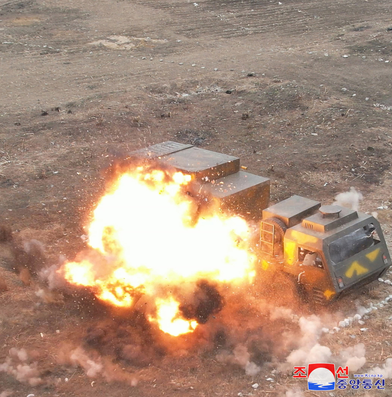 This image, published by the Korean Central News Agency on Thursday shows a North Korean suicide drone striking a target similar in appearance to South Korea's mobile Long-range Surface-to-Air Missile system in a test overseen by North Korean leader Kim Jong-un. (Yonhap)