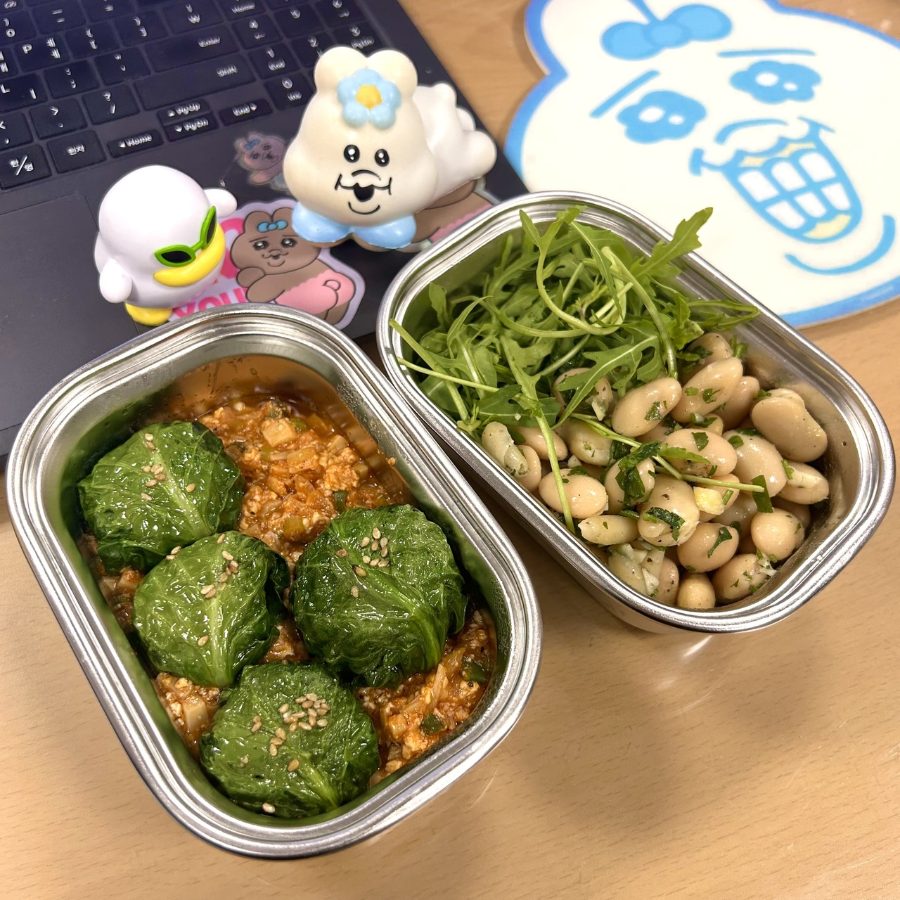Ha Sang-hee's lunchbox features a kale-wrapped brown rice ball, spicy soybean paste and a legume salad with arugula. She shares her "slow-aging" homemade meals regularly on her X account. (Ha Sang-hee)