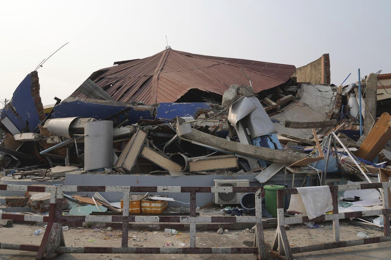 A collapsed building is seen after a powerful earthquake in Naypyitaw, Myanmar, Saturday. (AP-Yonhap)
