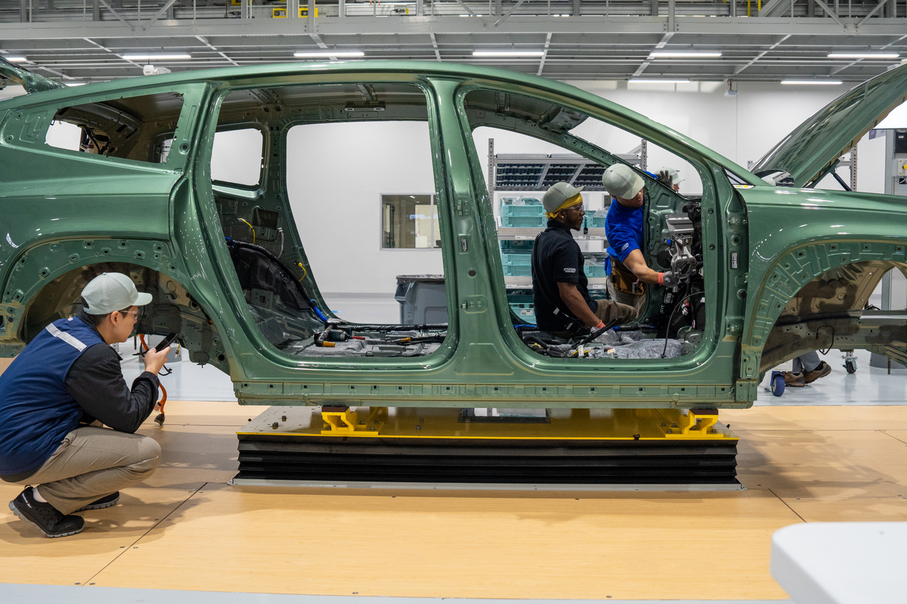Workers inspect a vehicle body at Hyundai Motor Group Metaplant America. (Hyundai Motor Group)