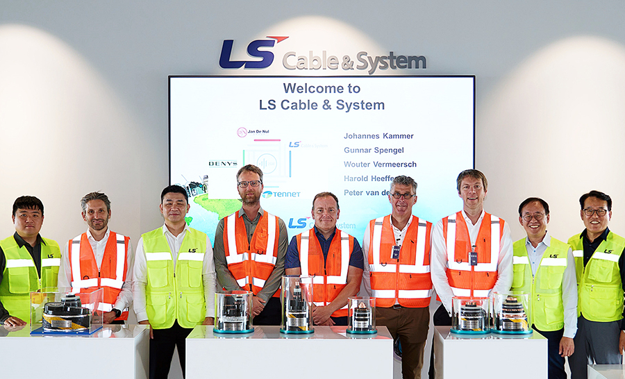 LS Cable & System officials pose for a photo with representatives from its partners to commemorate the mass production of 525-kilovot high-voltage direct current cables at the firm's site in Donghae, Gangwon Province, May 30, 2024. (LS Cable & System)