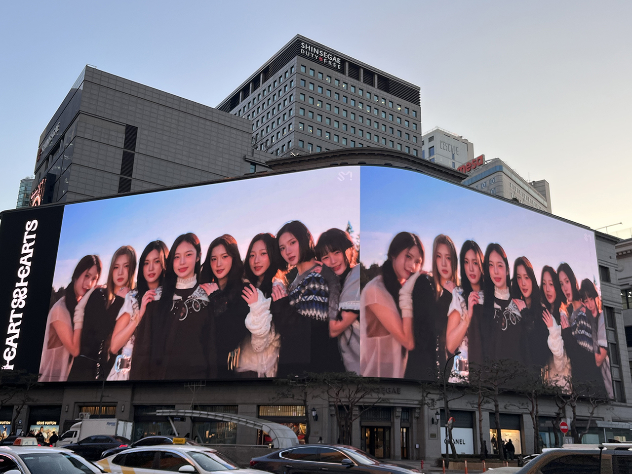 Hearts2Hearts, SM Entertainment's new girl group, is promoted on "Shinsegae Square" billboard in Jung-gu, Seoul, March 24. (SM Entertainment)