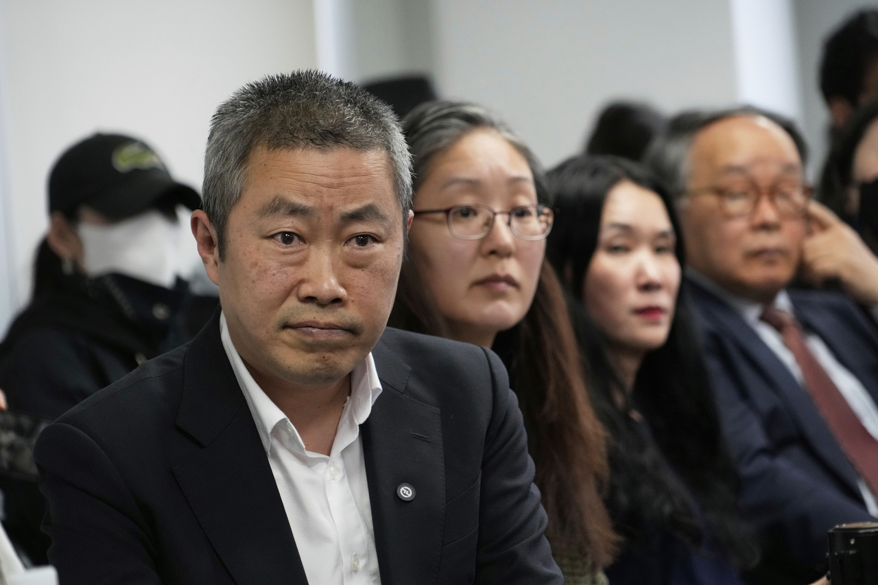 Co-founders of the Danish Korea Rights Group, Peter Møller (left) and Boonyoung Han (second from left), and adoptee Kim Yooree (second from right) attend a press conference at the Truth and Reconciliation Commission in Seoul on Wednesday, March 26.  (AP-Yonhap)