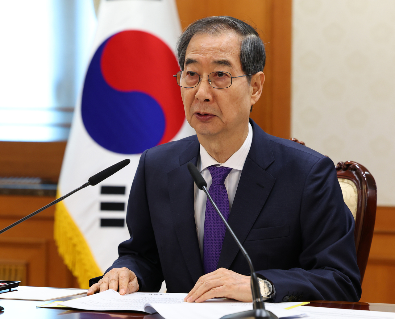 Acting President and Prime Minister Han Duck-soo presides over a meeting attended by the heads of the justice, science, defense and interior ministries to discuss safety measures tied to the upcoming Constitutional Court ruling on President Yoon Suk Yeol's impeachment, held at the Seoul Government Complex on Wednesday. Yonhap