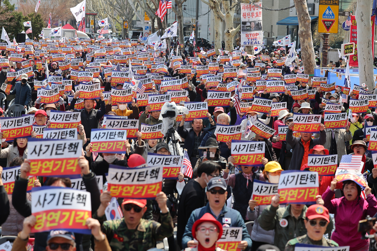 One day ahead of suspended President Yoon Suk Yeol's impeachment ruling, anti-impeachment rallies are being held near Anguk Station on Thursday. (Yonhap)