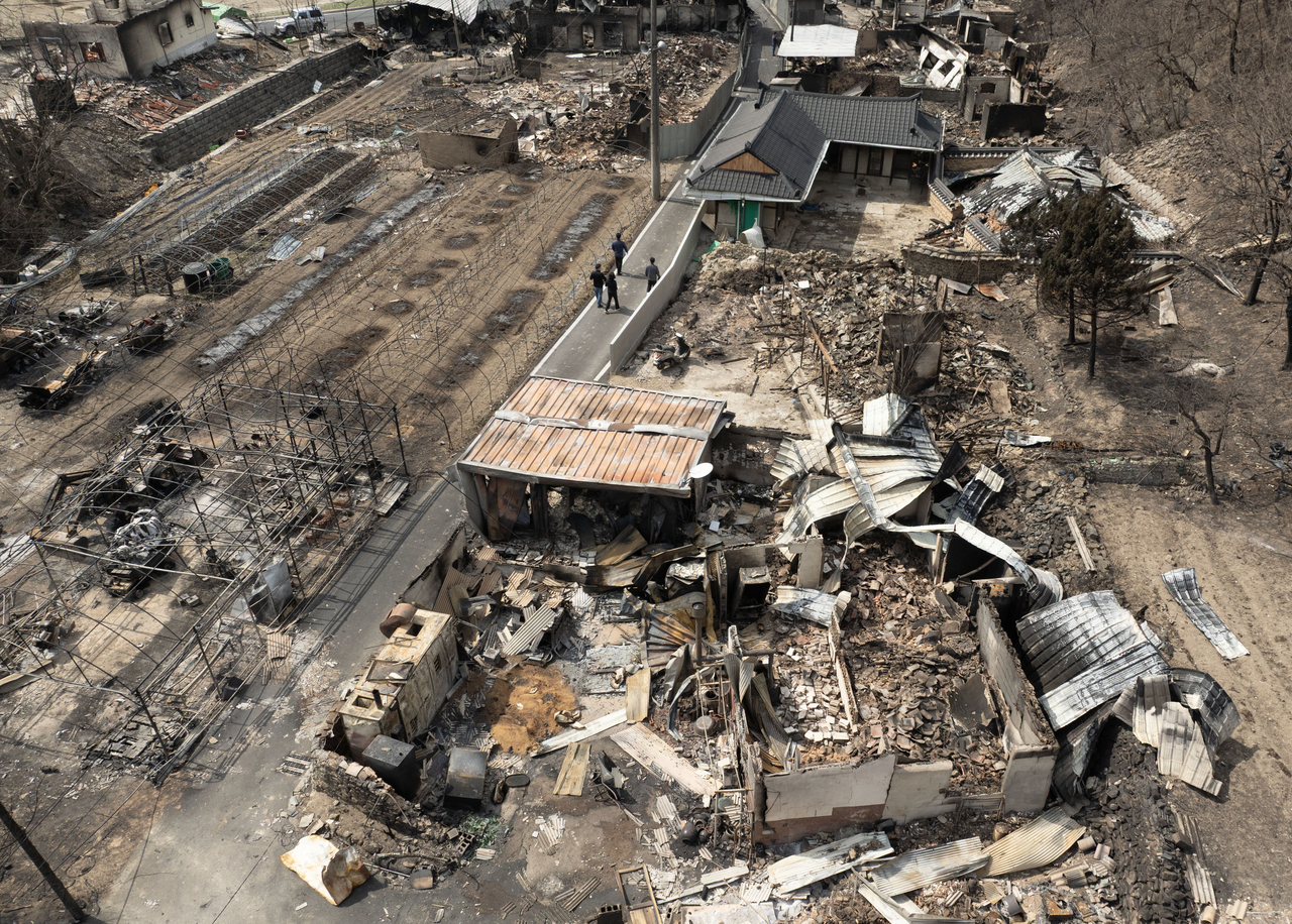 An aerial view shows a village in Andong, North Gyeongsang Province, left in ruins by wildfires on Saturday. (Yonhap)