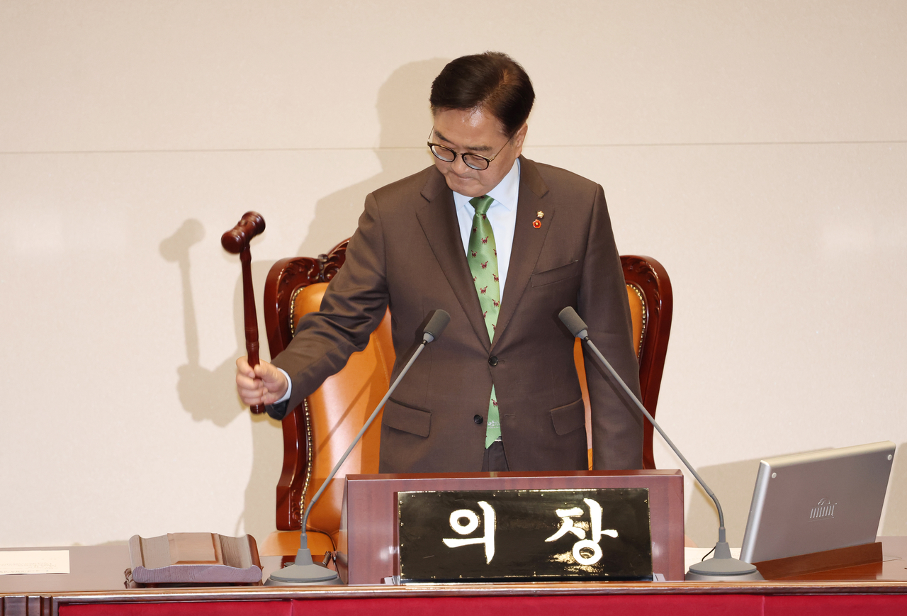 On Dec. 14, 2024, after a tense plenary session, National Assembly Speaker Woo Won-shik announces the passage of a motion to impeach Yoon Suk Yeol, immediately suspending him from duty. (Lee Sang-sub/The Korea Herald)