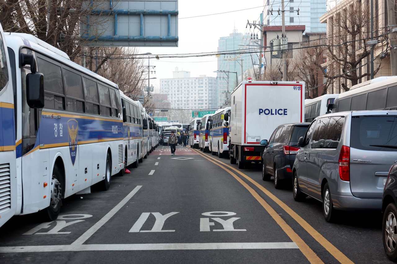 A blockade of police vehicles is seen outside the Constitutional Court in Jongno-gu, central Seoul, Friday. (Yonhap)
