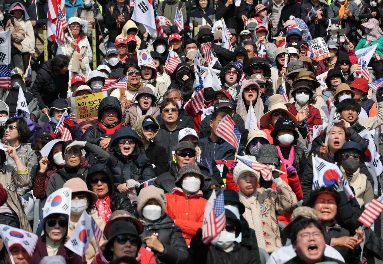 Supporters of Yoon Suk Yeol react to the verdict at a rally near the presidential residence in Hannam-dong, Seoul on Friday. (Joint Press Corps)
