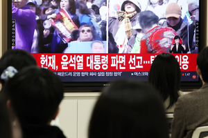 ‘Finally, relief’: Koreans embrace Yoon impeachment ruling