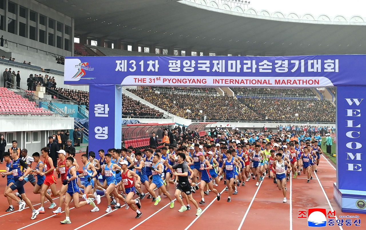 Runners, including those from abroad, take part in an international marathon in Pyongyang on Sunday in this photo released by North Korea's official Korean Central News Agency the next day. It marked the North's first international marathon in about six years after a hiatus due to COVID-19. (Yonhap)