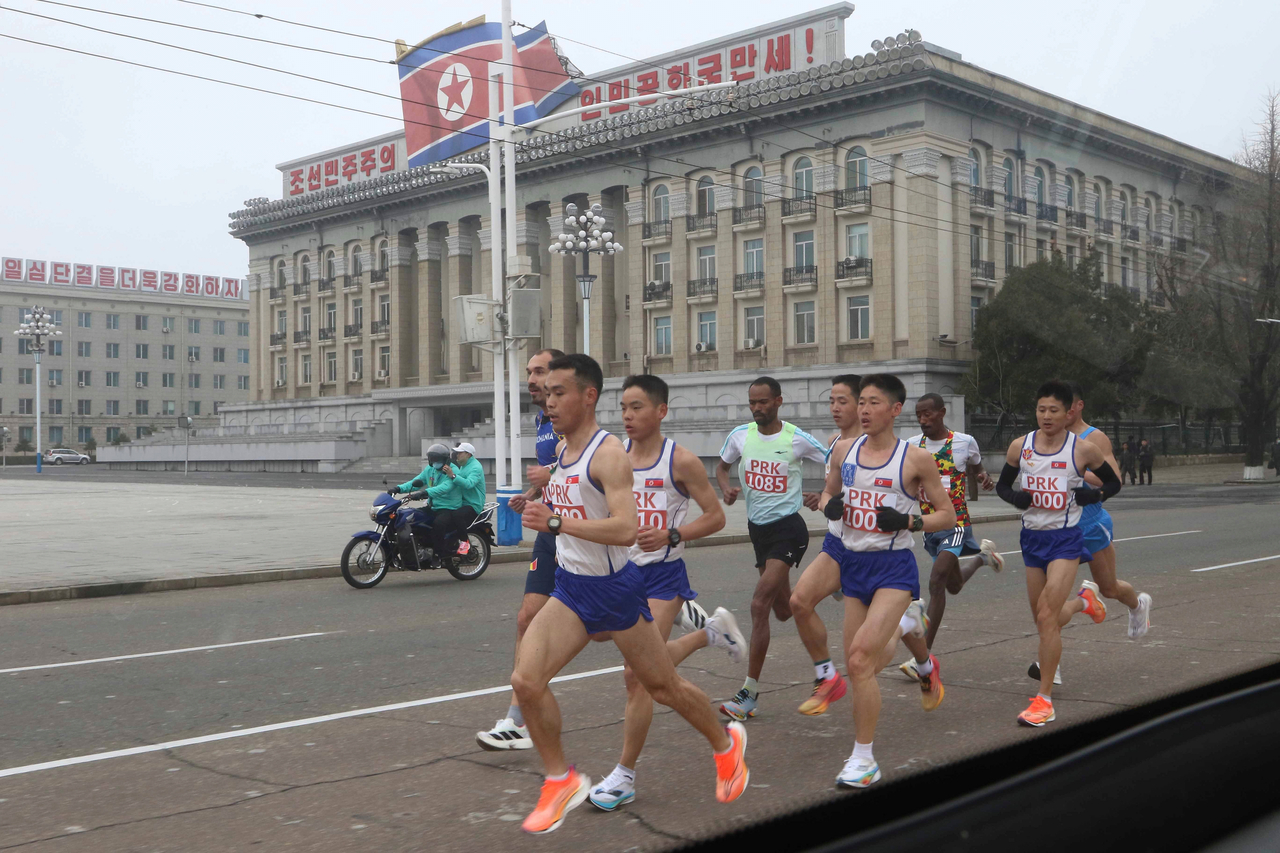 Runners take part in the Pyongyang International Marathon in Pyongyang, North Korea on Sunday. (AP-Yonhap)