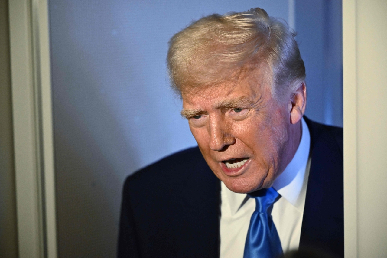 US President Donald Trump speaks to reporters while in flight on Monday. (AFP-Yonhap)