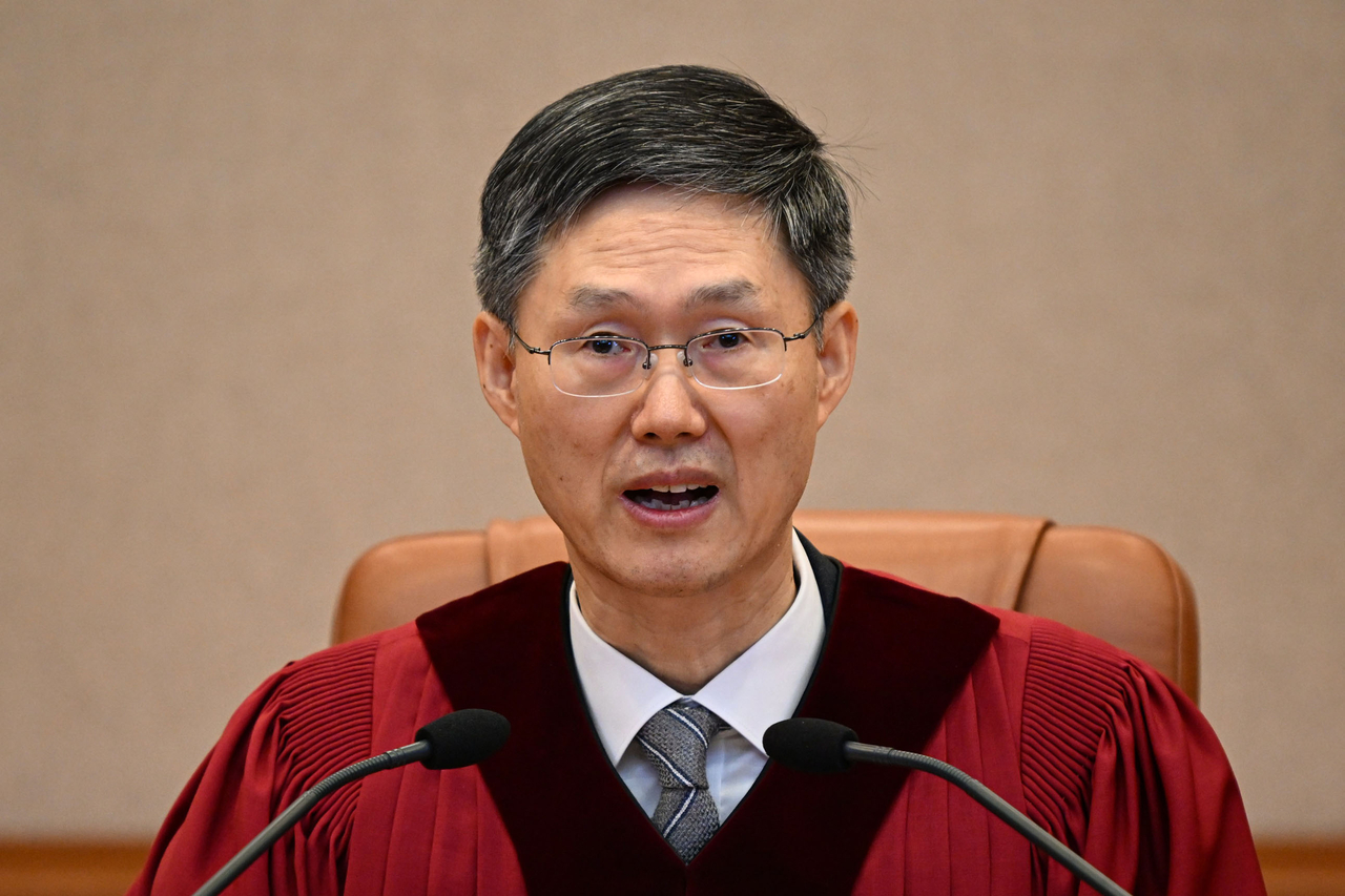 Acting Chief Justice Moon Hyung-bae on the day the Constitutional Court of Korea issued its ruling to uphold the impeachment of President Yoon Suk Yeol, Friday. (Yonhap)