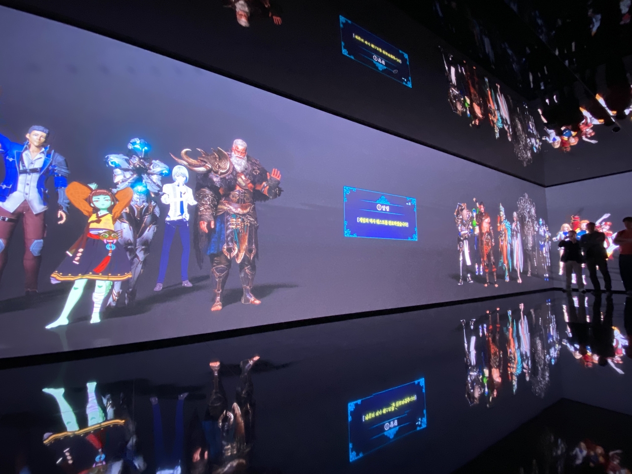 Netmarble’s game characters appear after a video on gaming's history concludes at the Netmarble Game Museum in Seoul on Tuesday. (Lim Jae-seong/The Korea Herald)