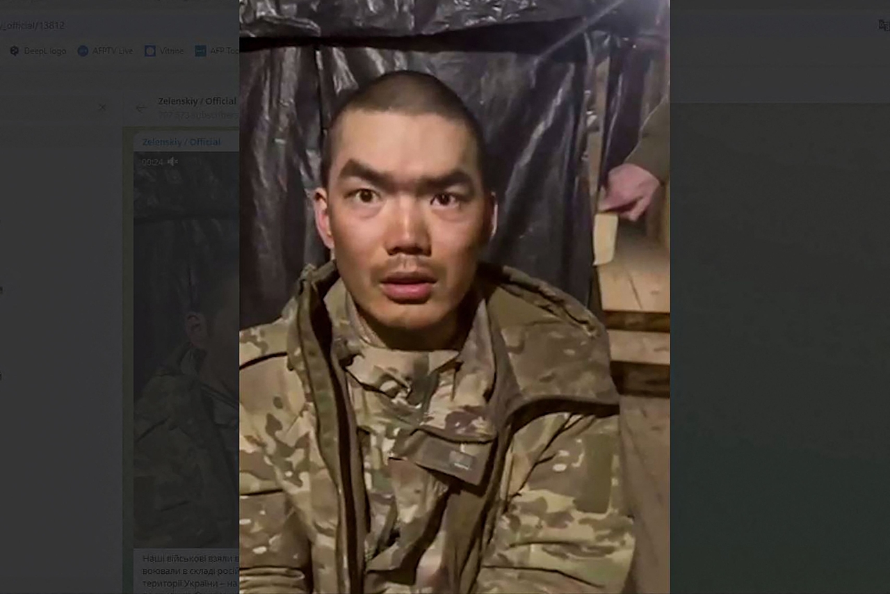 One of two alleged Chinese soldiers captured by Ukrainian forces in the Donetsk region, Tuesday.   (AFP-Yonhap)