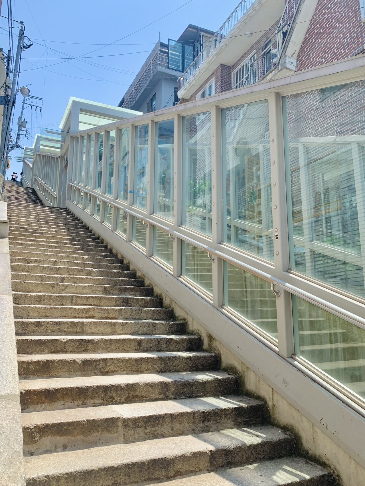 An inclined elevator was installed in the middle of the stairs in 2018. (No Kyung-min/The Korea Herald)
