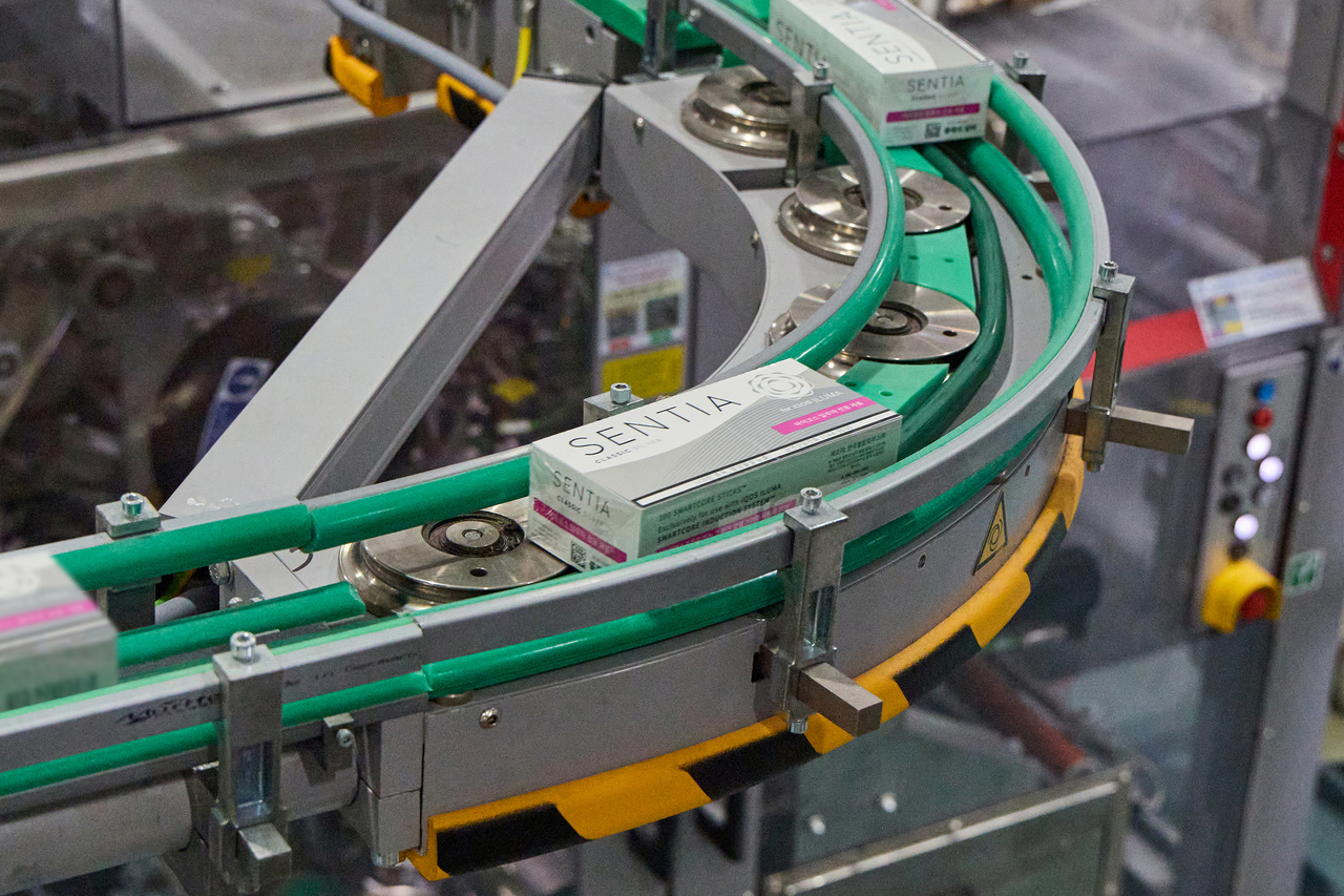 Packs of Sentia, Philip Morris International's tobacco stick brand, are conveyed on an assembly line at a manufacturing plant in Yangsan, South Gyeongsang Province. (Philip Morris Korea)