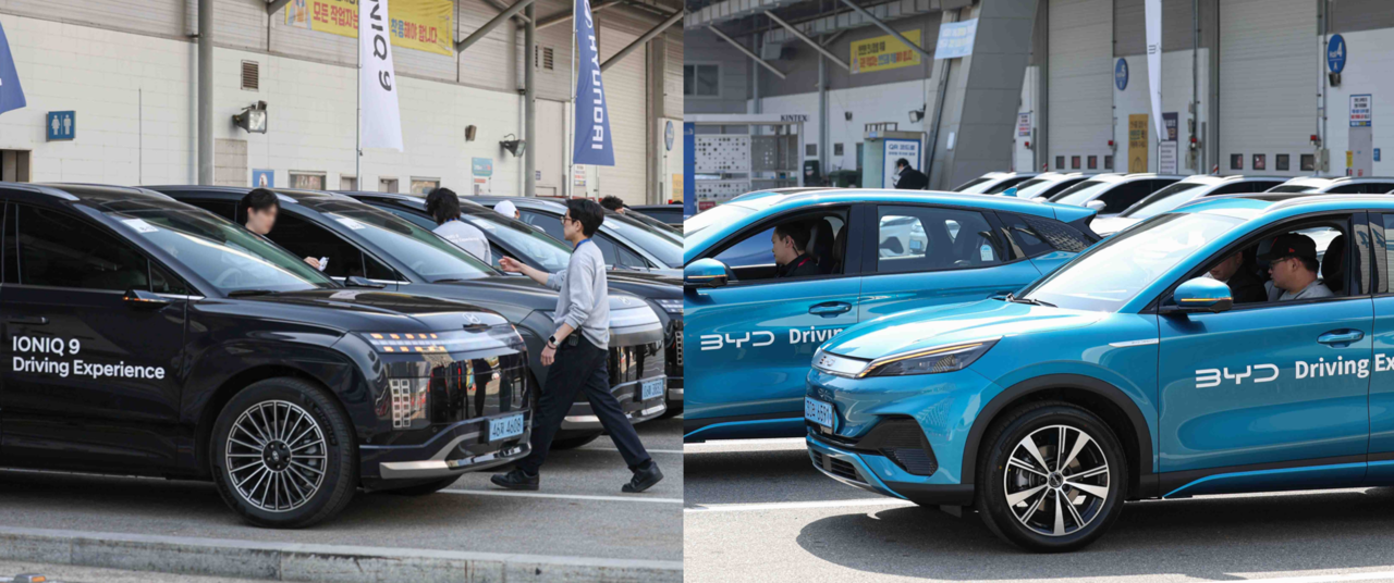 Visitors take part in test drive of Hyundai Motor's Ioniq 9 (left) and BYD's Atto 3 at the Seoul Mobility Show 2025 at Kintex in Goyang, Gyeonggi Province. (Seoul Mobility Show organizers)