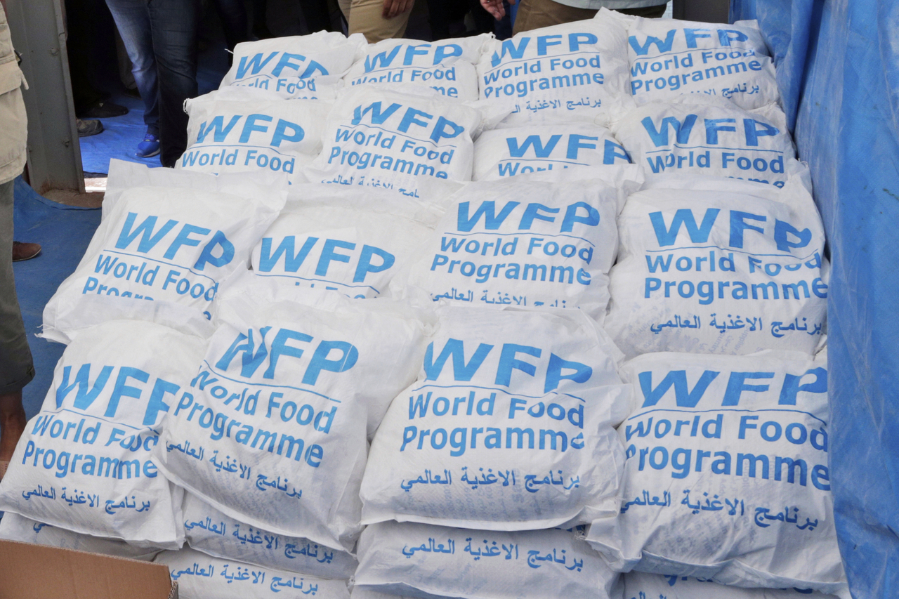 Food parcels provided by the World Food Program, part of the humanitarian aid shipments into Syria, are stacked at the Reyhanli border crossing with Syria, near Hatay, southern Turkey, Wednesday. (AP-Yonhap )
