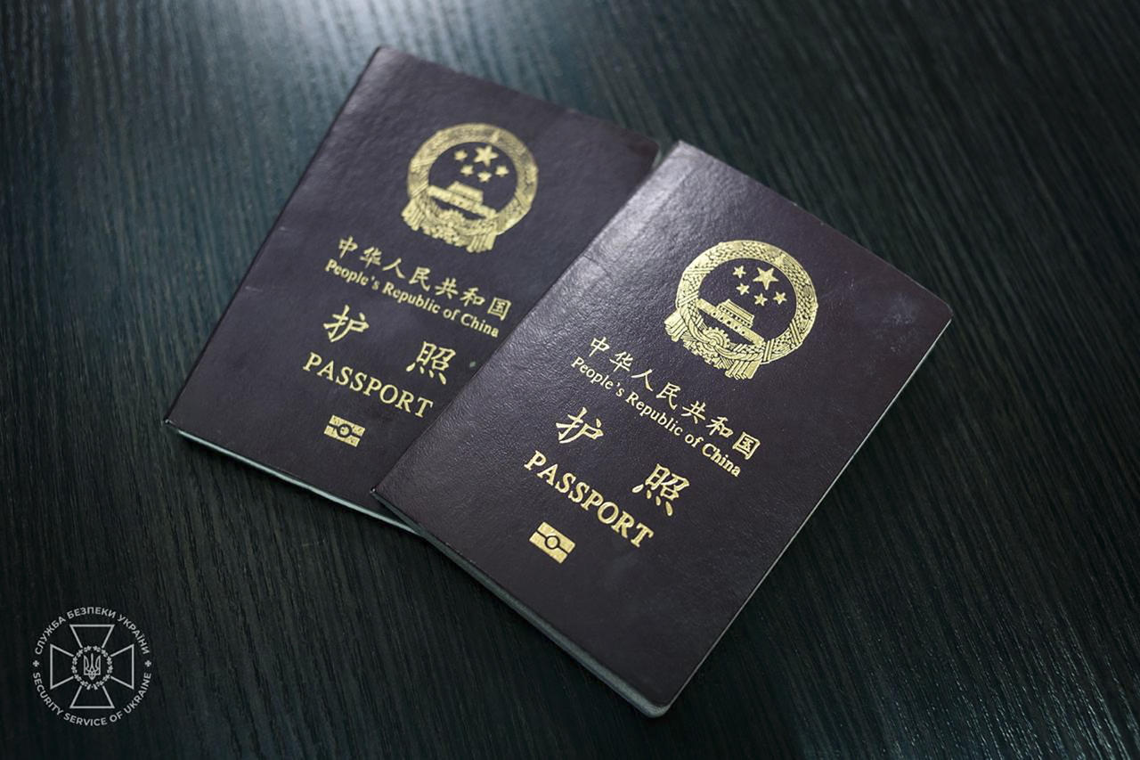 Passports of the two Chinese men that Ukraine stated they captured fighting alongside Russia, during their questioning in the Security Service in Kyiv, Ukraine, Wednesday. (EPA-Yonhap)