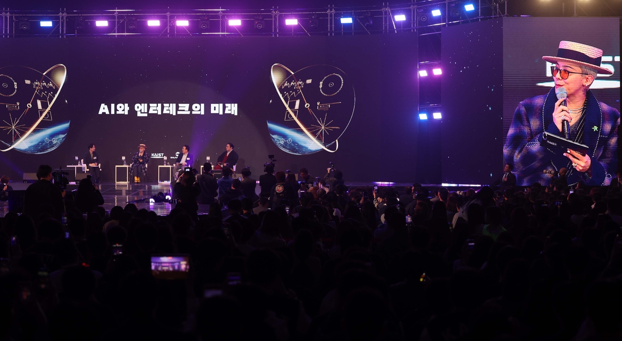 Screen shows G-Dragon speaking during a panel session at "Innovate Korea 2025" forum held at KAIST in Daejeon on Wednesday. (Yonhap)