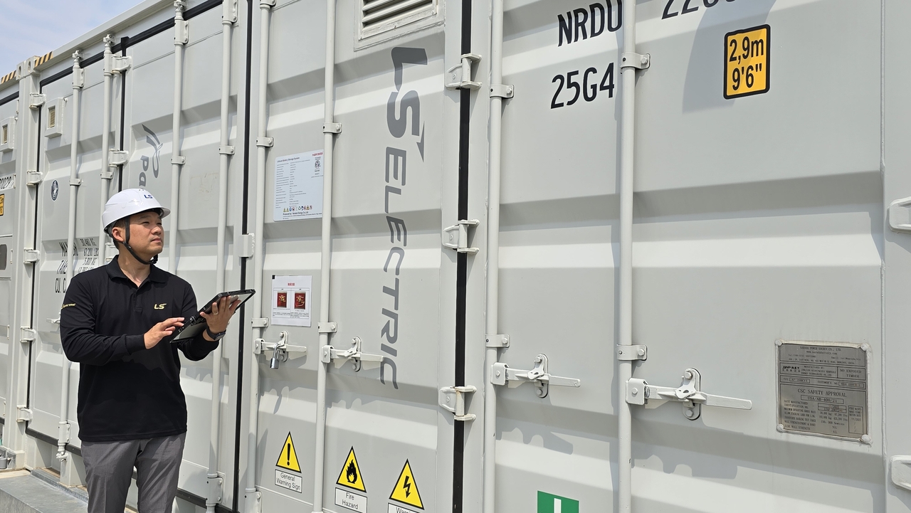 An LS Electric official checks the company's energy storage facility in Hokkaido, Japan. (LS Electric)