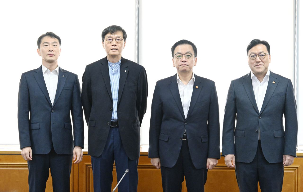 (From left to right) Financial Supervisory Service chief Lee Bok-hyun, Bank of Korea Gov. Rhee Chang-yong, Finance Minister Choi Sang-mok, who serves concurrently as deputy prime minister for economic affairs, and Financial Services Commission head Kim Byoung-hwan attend a meeting on macroeconomic and financial affairs at the Hall of Banks in Seoul on Friday. (Ministry of Economy and Finance)