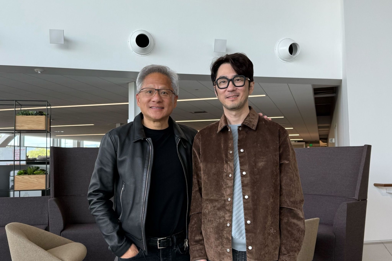 Krafton CEO Kim Chang-han (right) poses for a photo with Nvidia CEO Jensen Huang at Nvidia's headquarters in Santa Clara, California, on Thursday. (Screencaptured from Krafton's LinkedIn page)