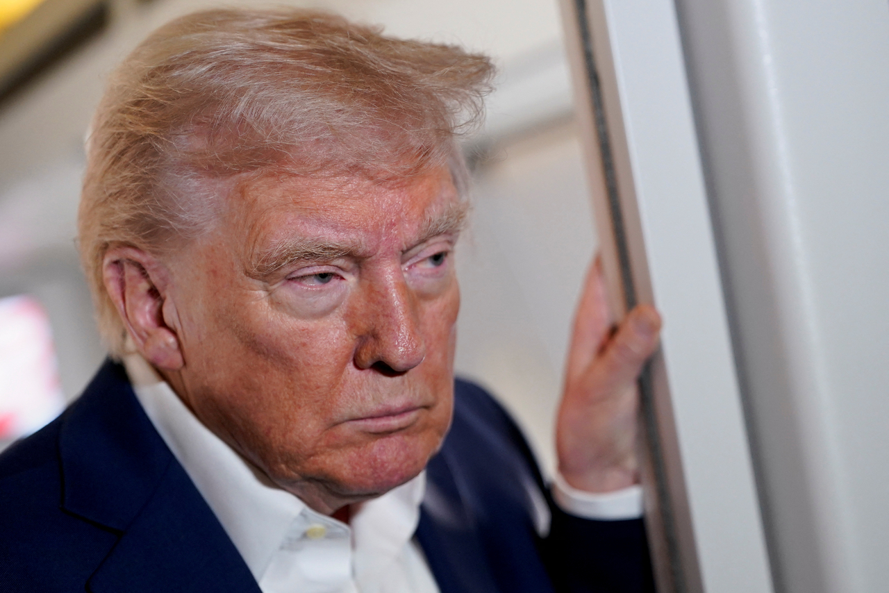 US President Donald Trump looks on while on board Air Force One on the way to Palm Beach International Airport, West Palm Beach, Florida, US, Friday (Reuters-Yonhap)