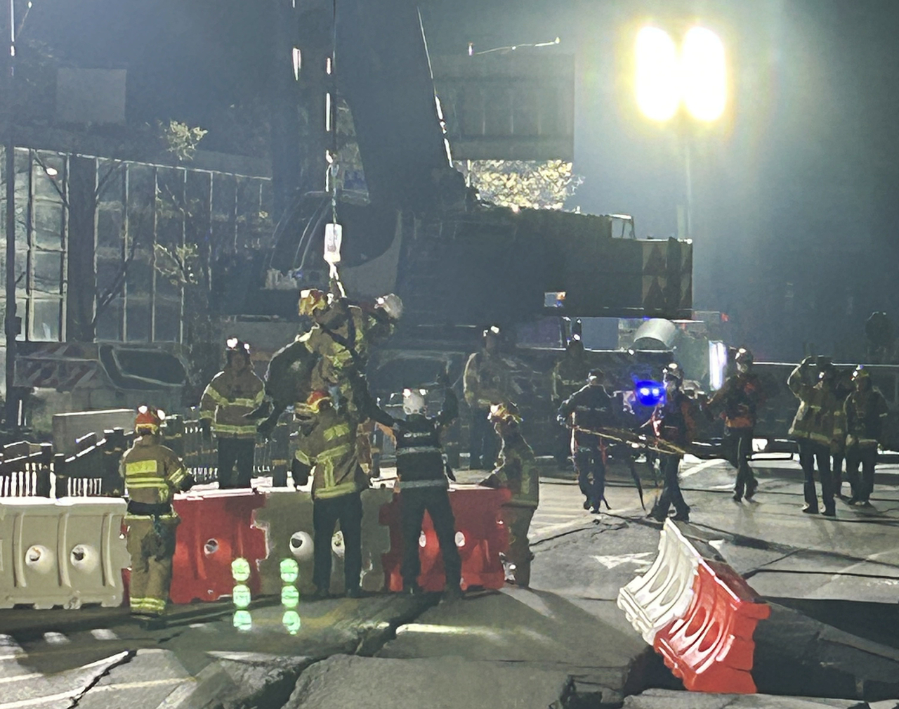 Authorities rescue a worker, who was trapped in a subway construction site collapse, in Gwangmyeong, just south of Seoul, on Saturday. (Gyeonggi Province Fire Services)